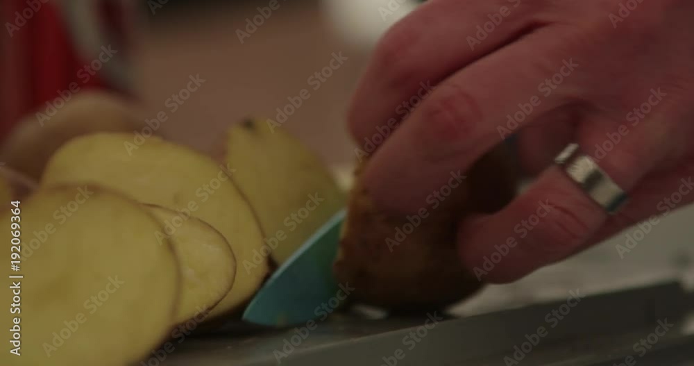 Person cuts potatoes, close up Person cuts potatoes, close up