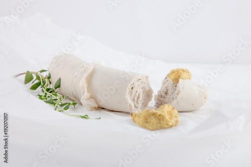 traditional bavarian white sausages on white paper can be used as background