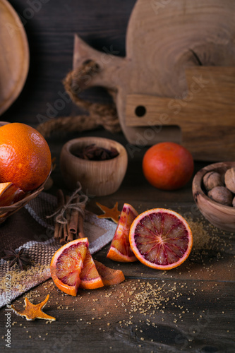 Fresh red orange fruit, anise, cinnamon and walnuts