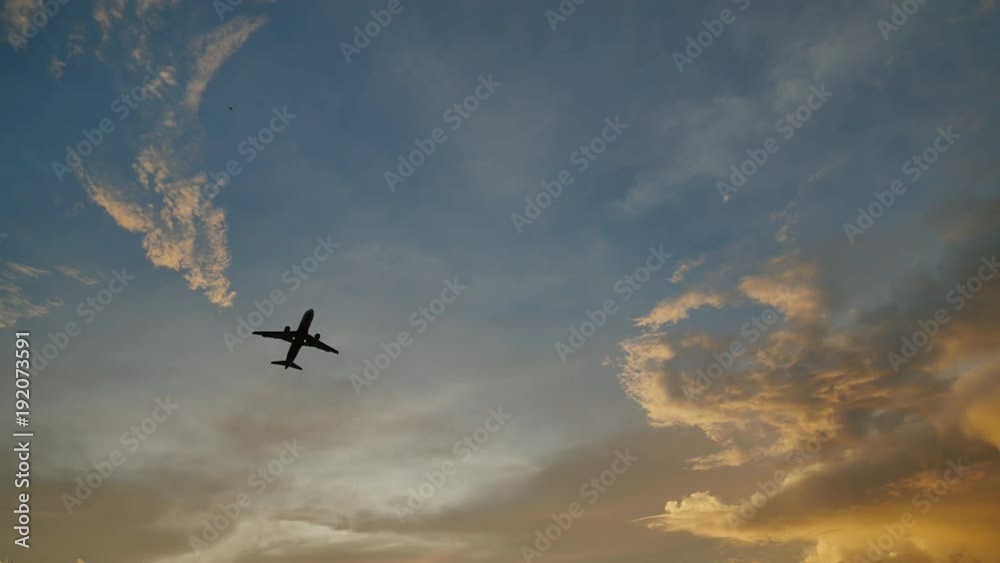 Passenger airplane taking off at sunset against the background of a very beautiful clouds. Passenger airplane taking off at sunset against the background of a very beautiful clouds.
