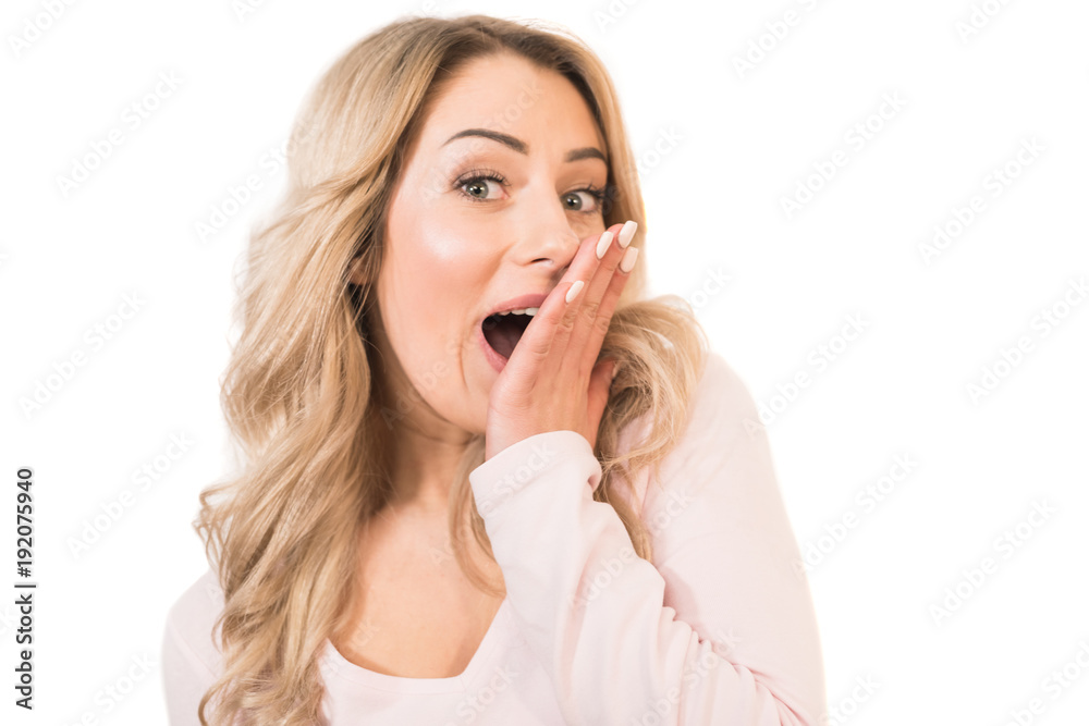 The pleased woman gesturing on the white background The pleased woman gesturing on the white background