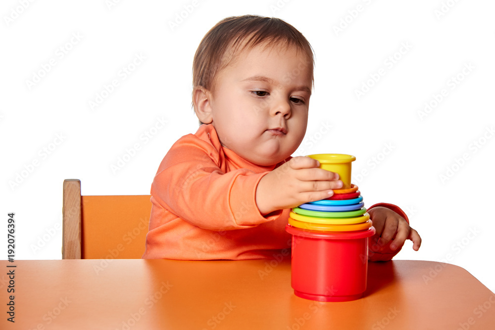 Child little girl learning to use colorful logic game isolated on white background Child little girl learning to use colorful logic game isolated on white background