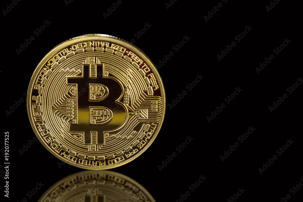 Golden bitcoin isolated on black background with reflection. Cryptocurrency mining concept. Free space for your text Golden bitcoin isolated on black background with reflection. Cryptocurrency mining concept. Free space for your text