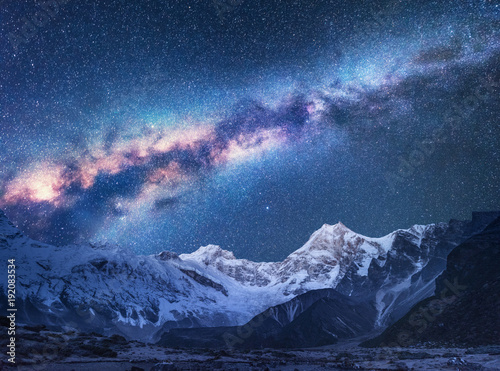 Space. Milky Way and mountains. Fantastic view with mountains and starry sky at night in Nepal. Mountain valley and sky with stars. Beautiful Himalayas. Night landscape with bright milky way. Galaxy