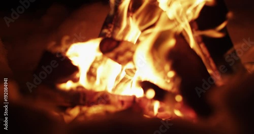 Rack focus, fire burns in slow motion