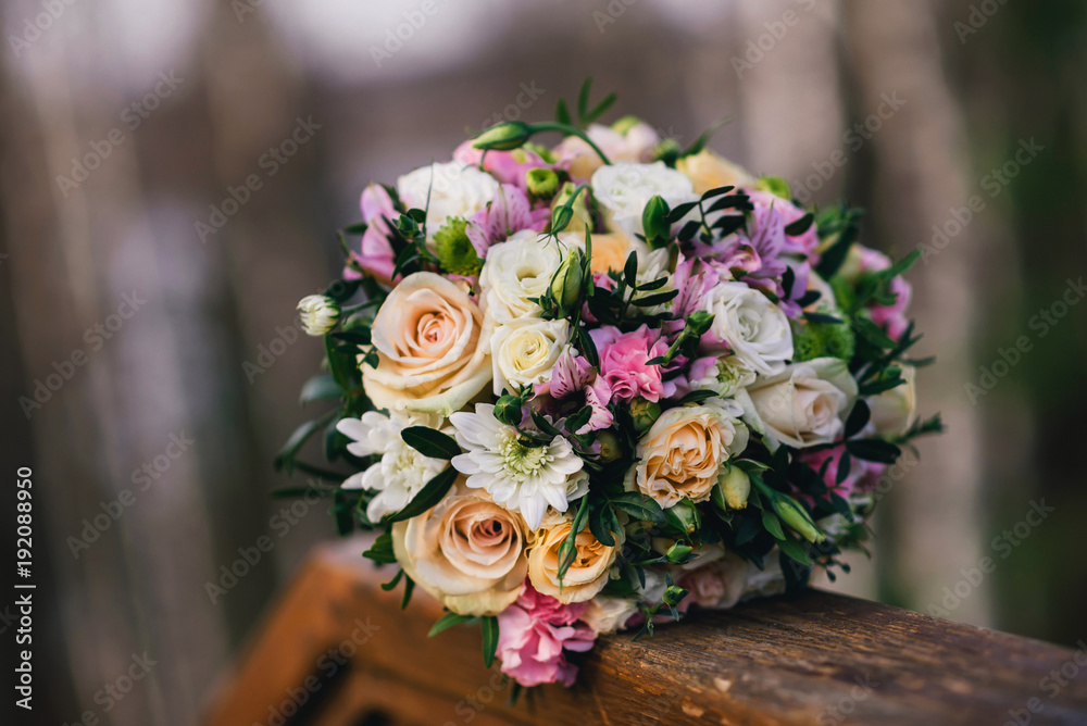 beautiful wedding bouquet with yellow roses, white chrysanthemums and pink Alstroemeria closeup