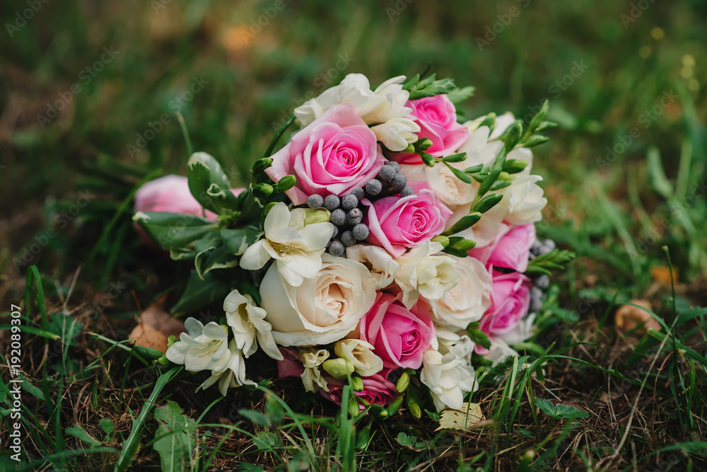 beautiful wedding bouquet with white and pink roses and other colorful flowers in nature beautiful wedding bouquet with white and pink roses and other colorful flowers in nature