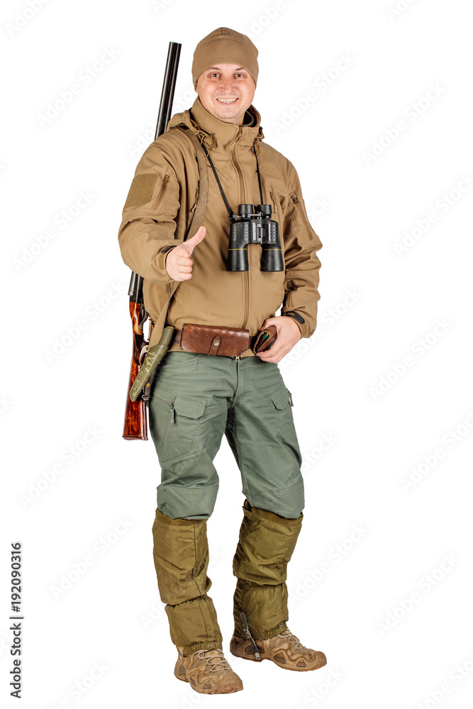 Full length portrait of a male hunter with double barreled shotgun Isolated on white background. hunting and people concept.