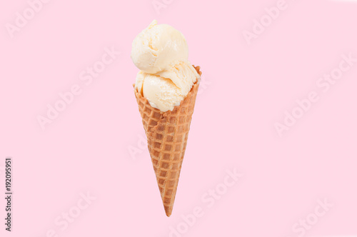 Vanilla ice cream cone on white background.