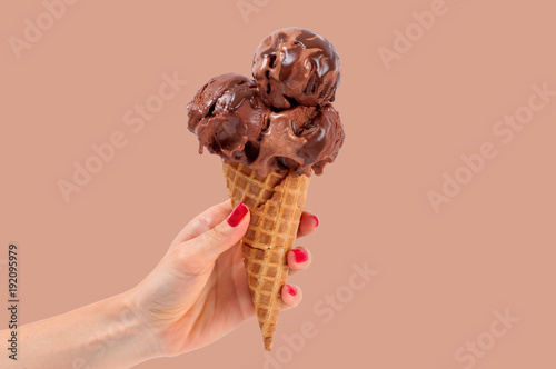 Chocolate  ice cream cone on white background.