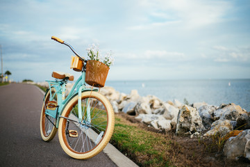 Leinwandbilder Fahrrad Fahrrad am Strand bei Sonnenuntergang  © Chad