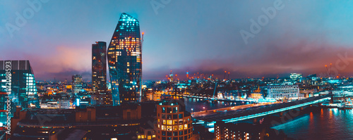 panoramic overview of london landscape with skyscrapers and Blackfriars Bridge at night