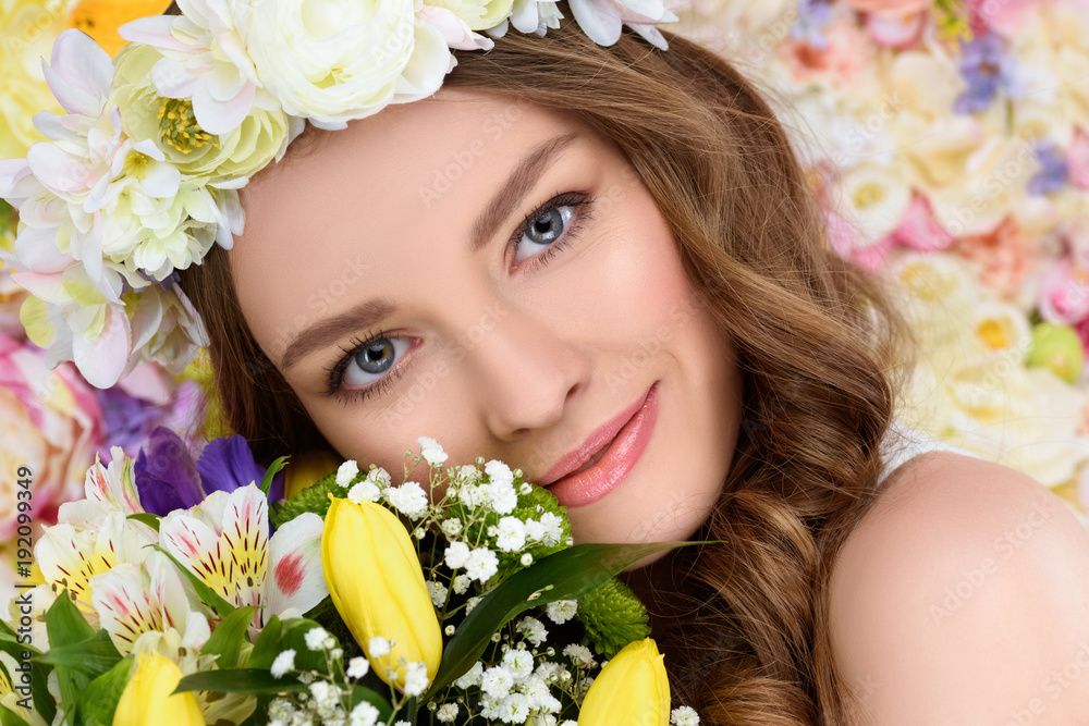 close-up portrait of happy young woman with floral wreath and bouquet close-up portrait of happy young woman with floral wreath and bouquet
