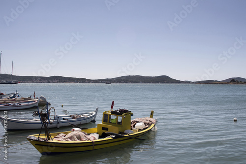 Small, wooden fishing boats and Aegean sea in Cunda (Alibey) isl