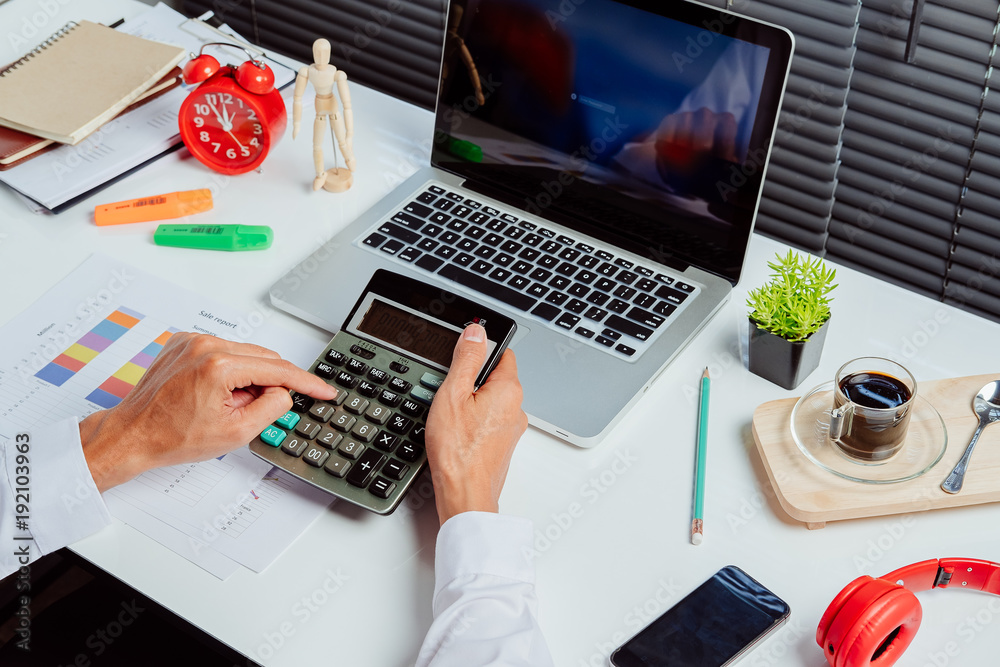 Businessman hand working with financial data Businessman hand working with financial data
