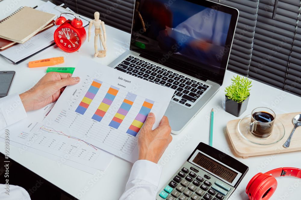 Businessman analyzing investment charts Businessman analyzing investment charts