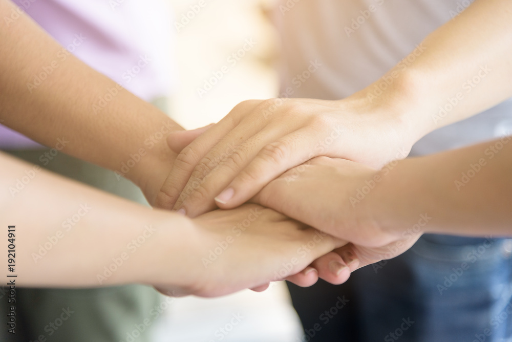 business has hands stacked together. business has hands stacked together.