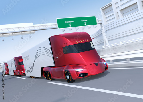 A fleet of self-driving electric semi trucks driving on highway. 3D rendering image.