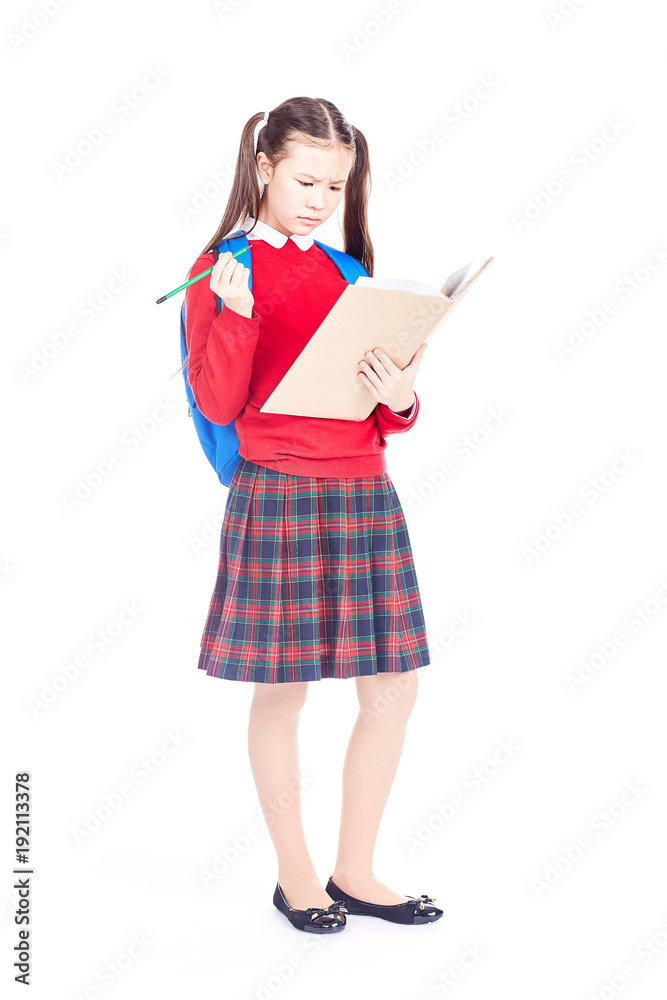 Full length portrait of Korean schoolgirl holding open notebook and pencil Full length portrait of Korean schoolgirl holding open notebook and pencil