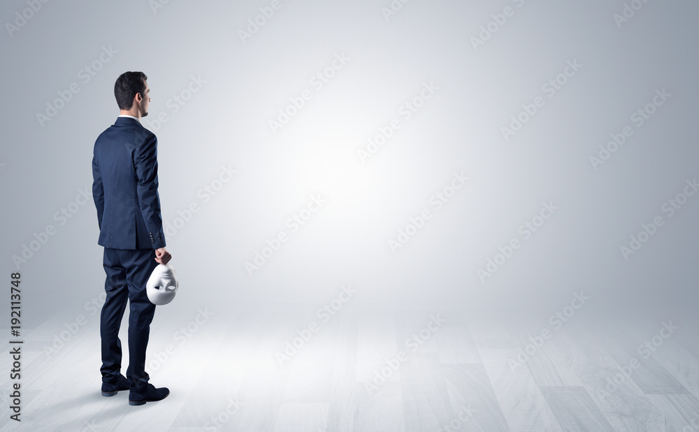 Man with object in his hand in an empty space Man with object in his hand in an empty space
