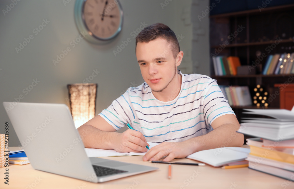 Student doing homework indoors late at night