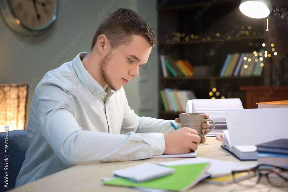 Student doing homework indoors late at night