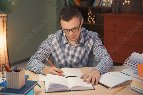 Student doing homework indo...
