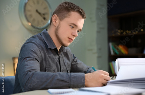 Student doing homework indoors late at night