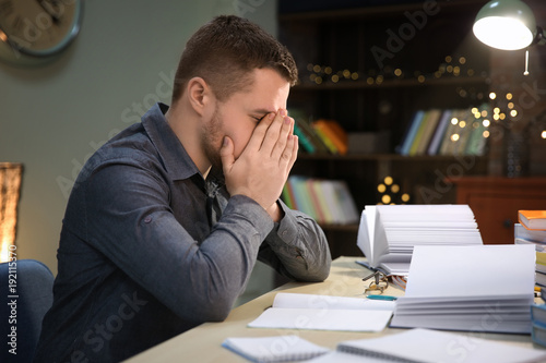 Tired student doing homewor...