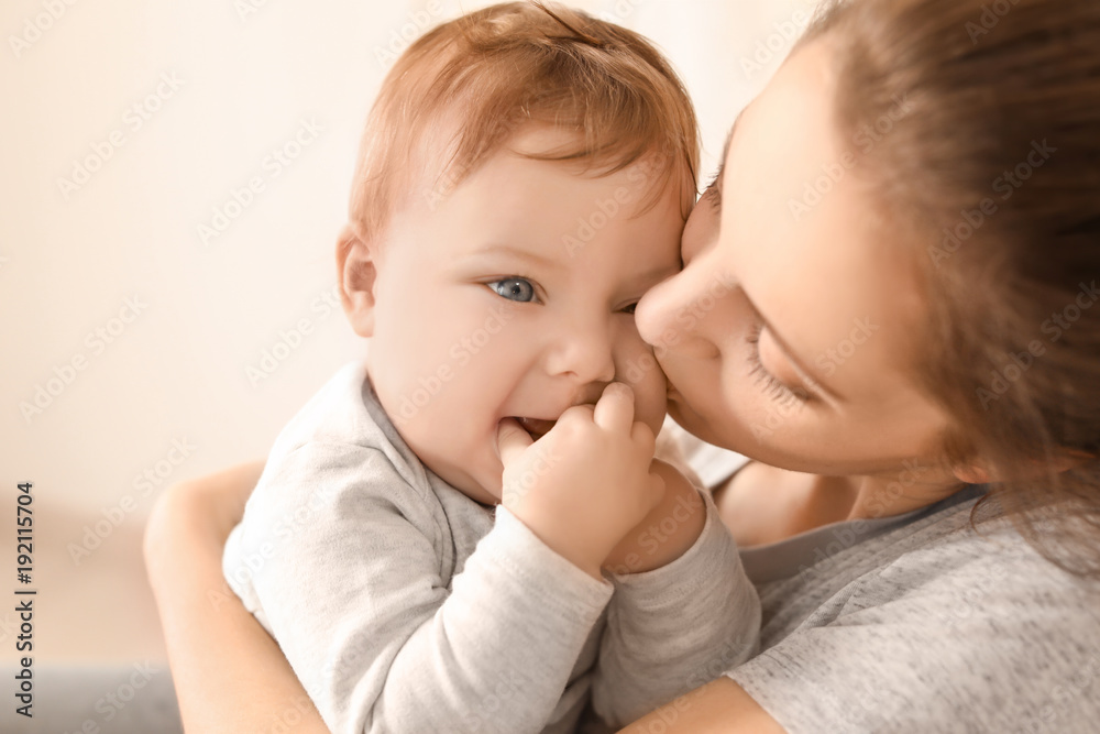 Young mother with her cute little baby at home Young mother with her cute little baby at home