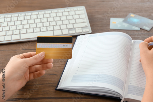 Woman with credit card and ...
