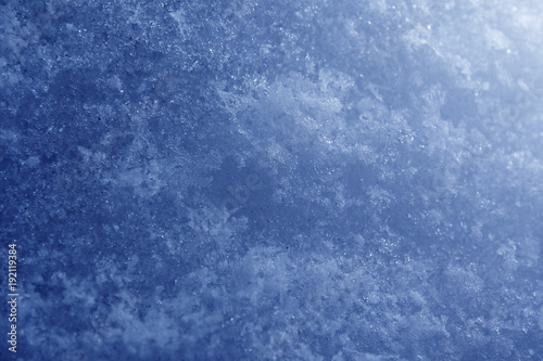 Background of grainy abstract blue snow. A winter snowy texture. 