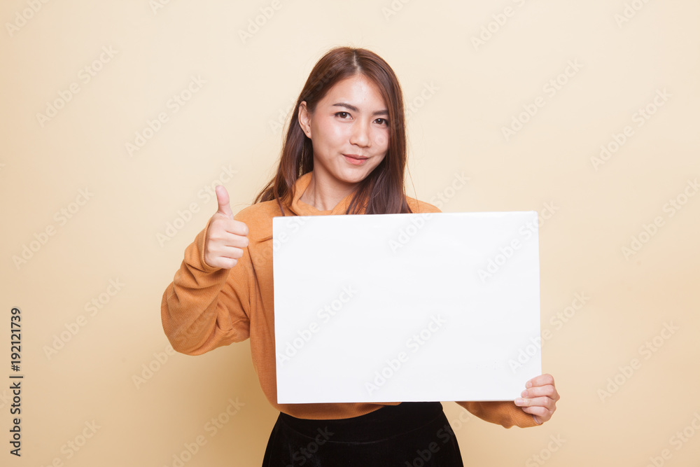 Young Asian woman show thumbs up with white blank sign. Young Asian woman show thumbs up with white blank sign.