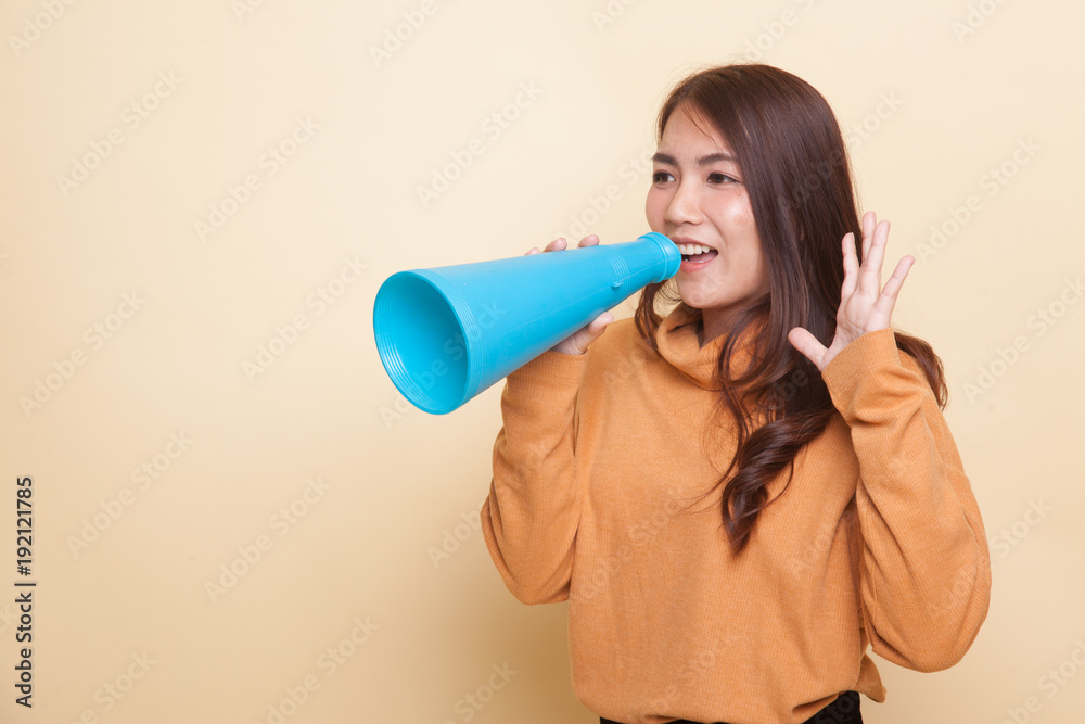 Beautiful young Asian woman announce with megaphone. Beautiful young Asian woman announce with megaphone.