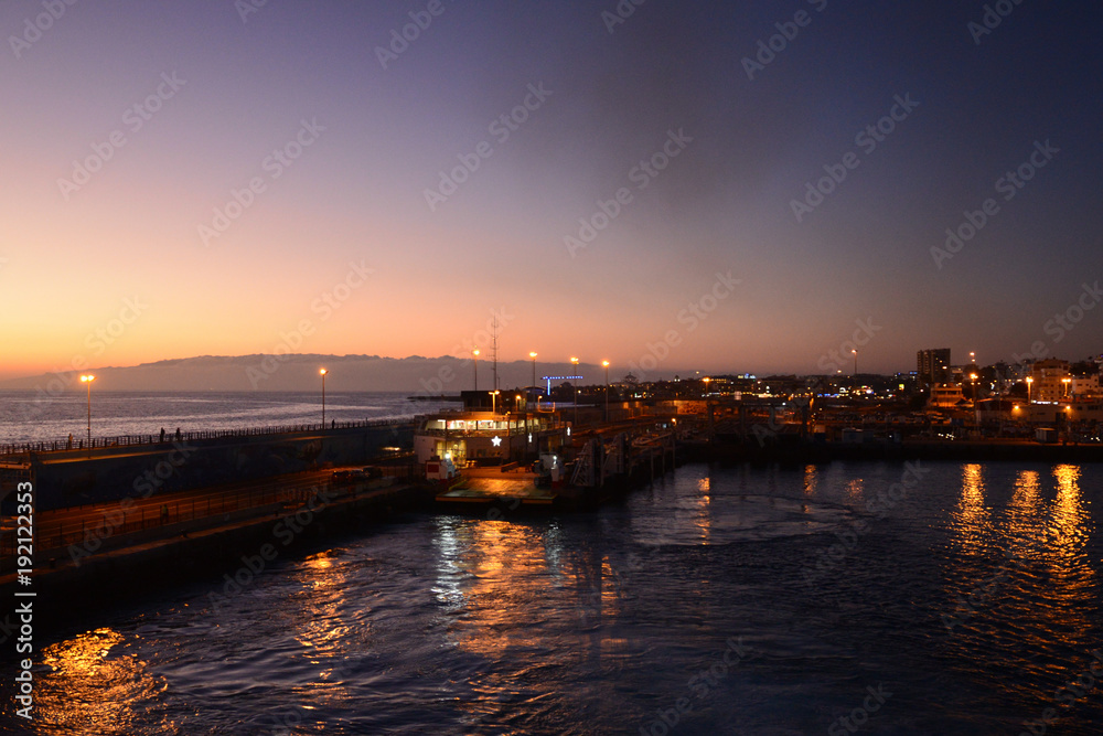 Travelling from Tenerife to La Gomera in the twilight with a ferry, view to the island La Gomera