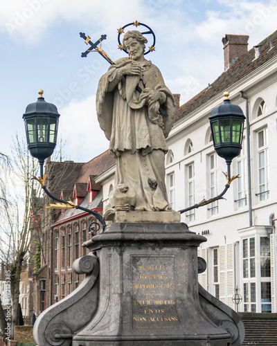 St. John of Nepomuk statue on bridge, Brugge, Belgium photo