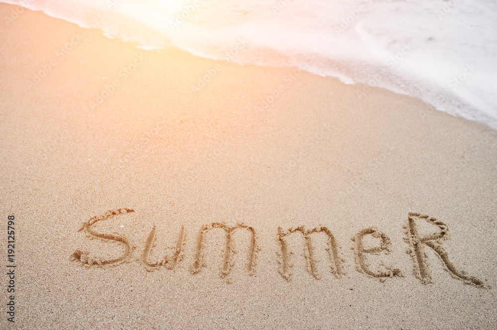 Fototapeta premium Close-up photo of sand inscription 