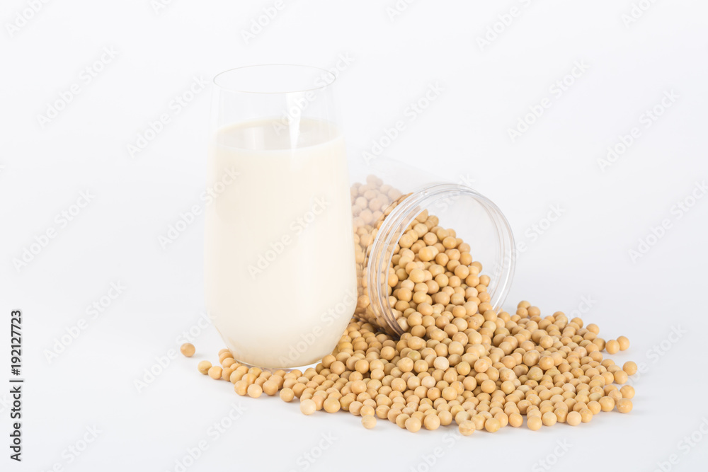 Soy milk in glass with soybeans on white background
Soy milk in glass with soybeans on white background