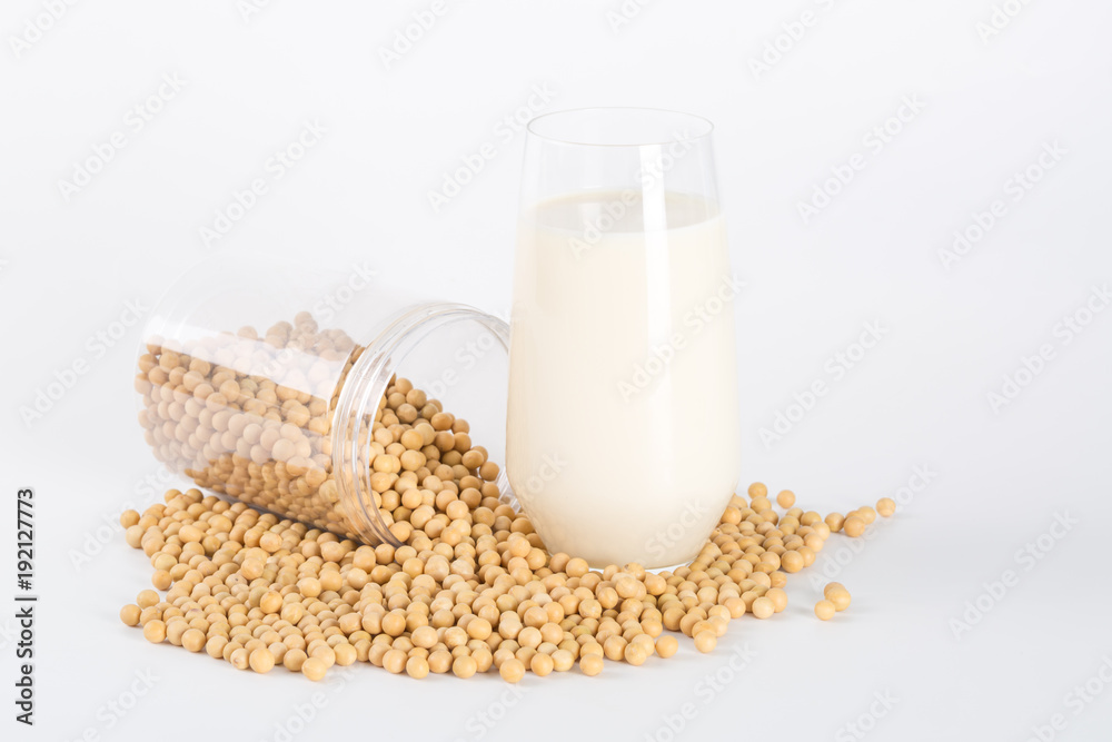 Soy milk in glass with soybeans on white background
Soy milk in glass with soybeans on white background
