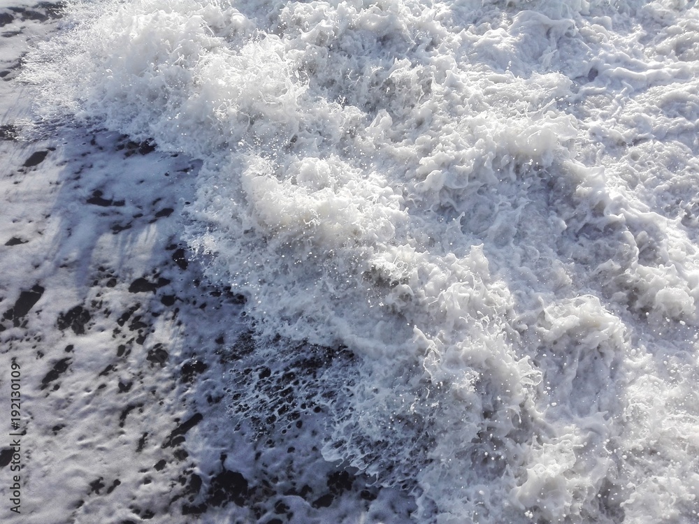 White foam of sea water waves as texture or background. Aerial view of water surface background, white foam of sea waves texture. Watersplashes as sea waves and foam background. Close-up of sea foam. White foam of sea water waves as texture or background. Aerial view of water surface background, white foam of sea waves texture. Watersplashes as sea waves and foam background. Close-up of sea foam.