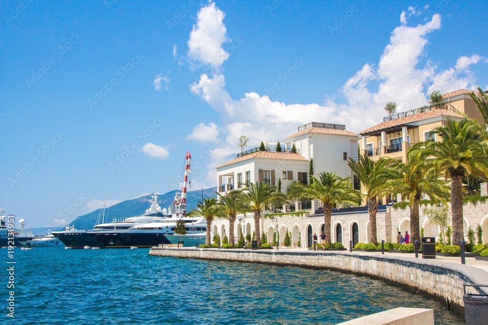 Fototapeta premium Montenegro. Embankment of Tivat city. View of Porto Montenegro Village. Montenegro. Embankment of Tivat city. View of Porto Montenegro Village. A small European city near the sea and mountains.