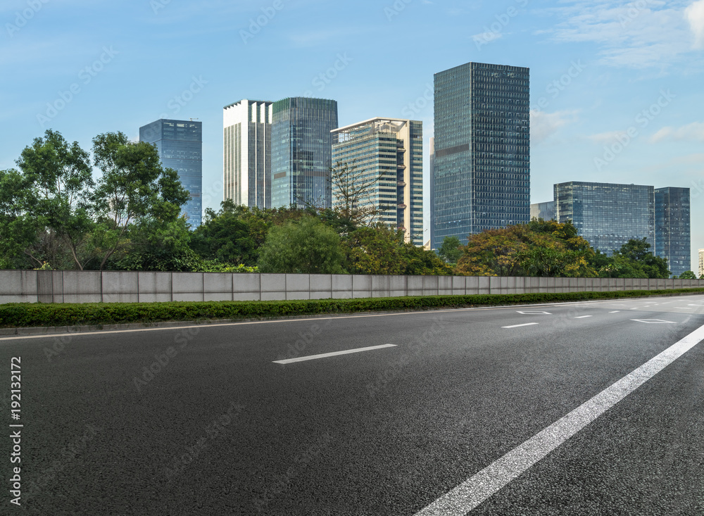 empty asphalt road front of modern buildings.