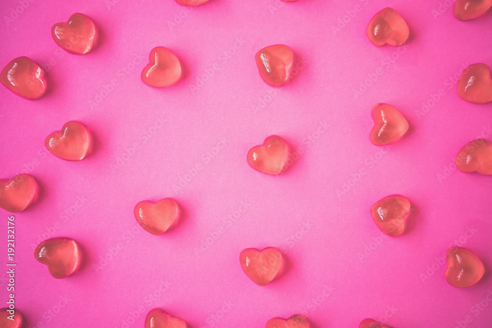 Valentines day background with heart shape candy on pink background Valentines day background with heart shape candy on pink background