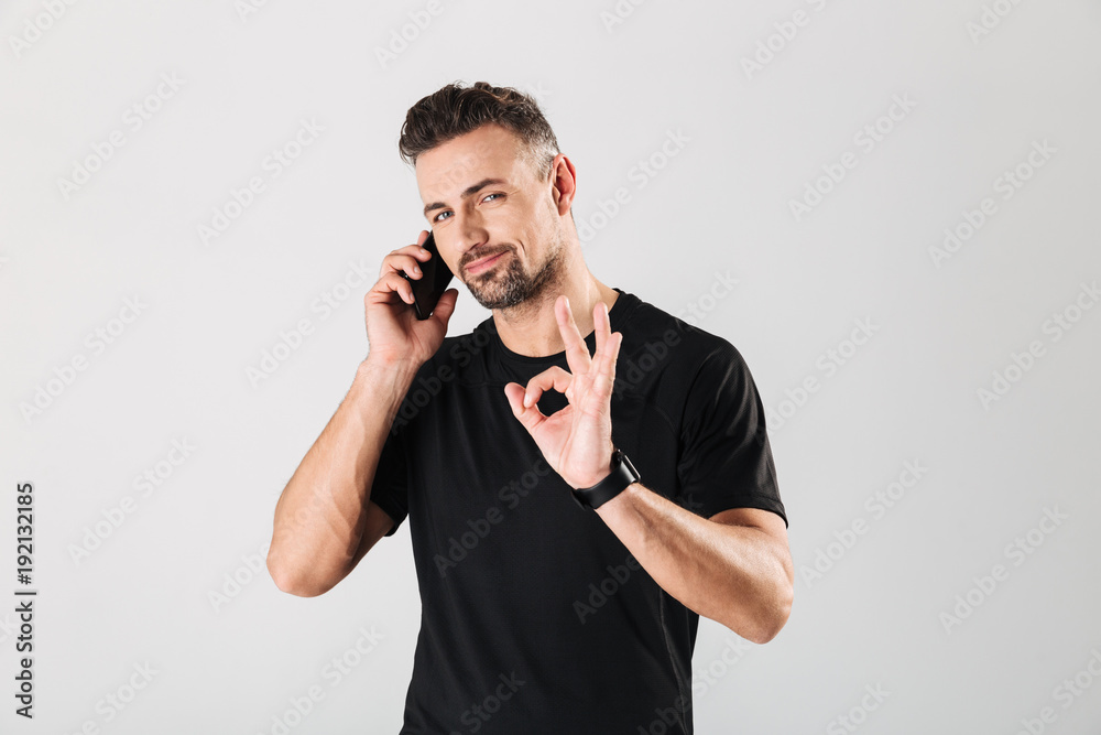 Portrait of a confident mature sportsman talking mobile phone Portrait of a confident mature sportsman talking mobile phone