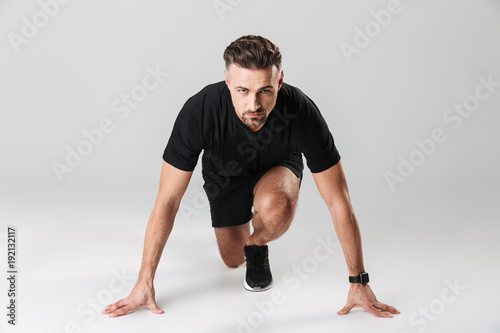 Portrait of a healthy mature sportsman ready to start
