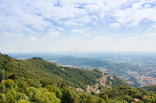 Beautiful mountain landscape. Top view of the mountain to a small town. Viewpoint from the top of Brunate. Italy. Views of landscape from the Lighthouse named Alessandro Volta.