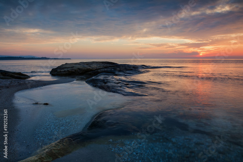 Sea sunrise at the Black Sea coast near Ravda, Bulgaria. Rocky sunriseл © d_zheleva