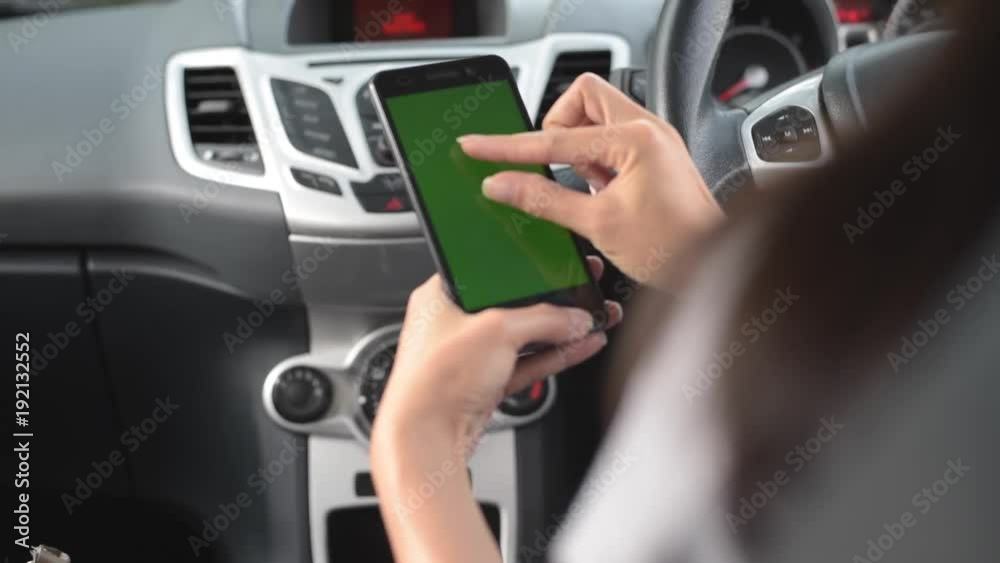 Chroma Key : Woman using a smart phone on car. Chroma Key : Woman using a smart phone on car.