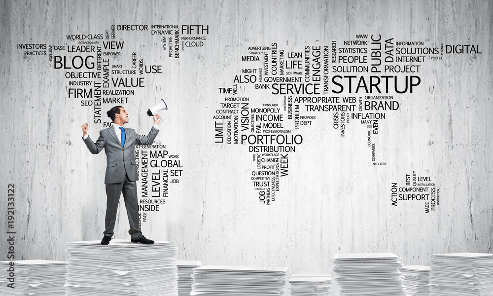 Businessman standing with megaphone.