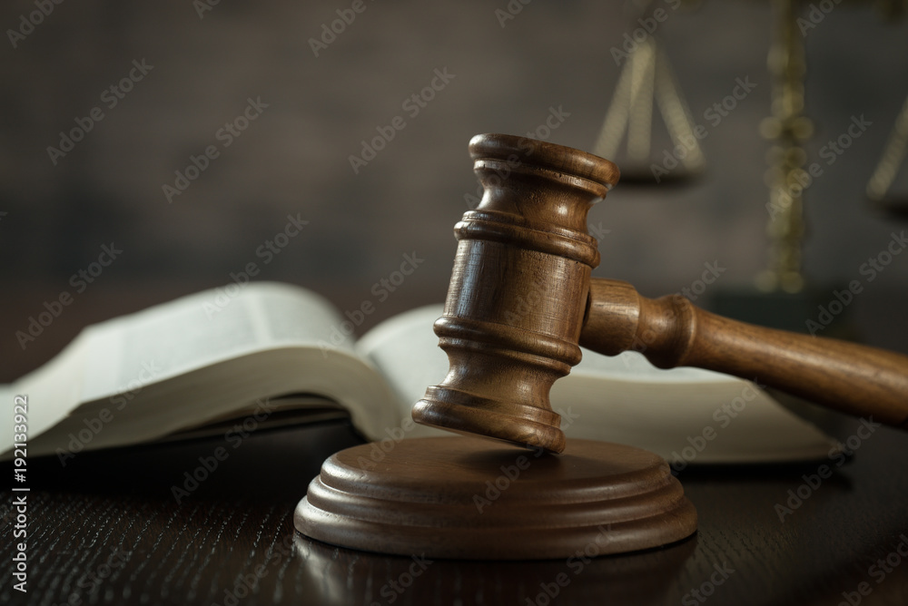 Law and Justice concept. Brown wooden background Law and Justice concept. Brown wooden background